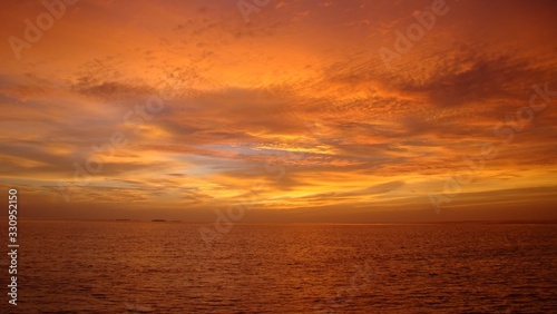 A beautiful and romantic sunset at the Maldives seen from a luxurious villa. Holidaying in Maldives without seeing a sunset is a bit like going to Paris without seeing the Eiffel Tower.