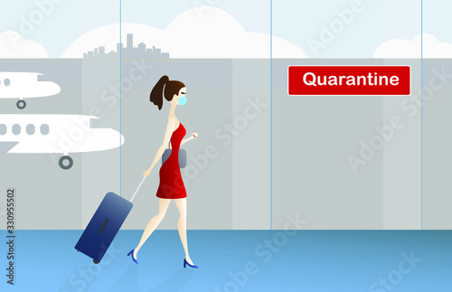 A young caucasian woman walks through the airport to the quarantine zone