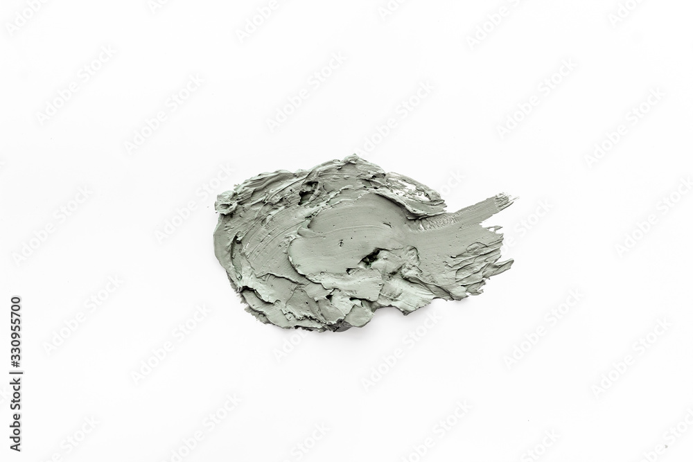Texture of mud mask. Blue clay for face smears on white background top-down copy space Texture of mud mask. Blue clay for face smears on white background top-down copy space