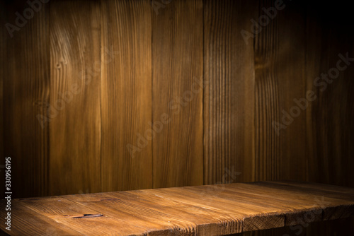 image of wooden table in front of abstract blurred background of resturant lights © kishivan