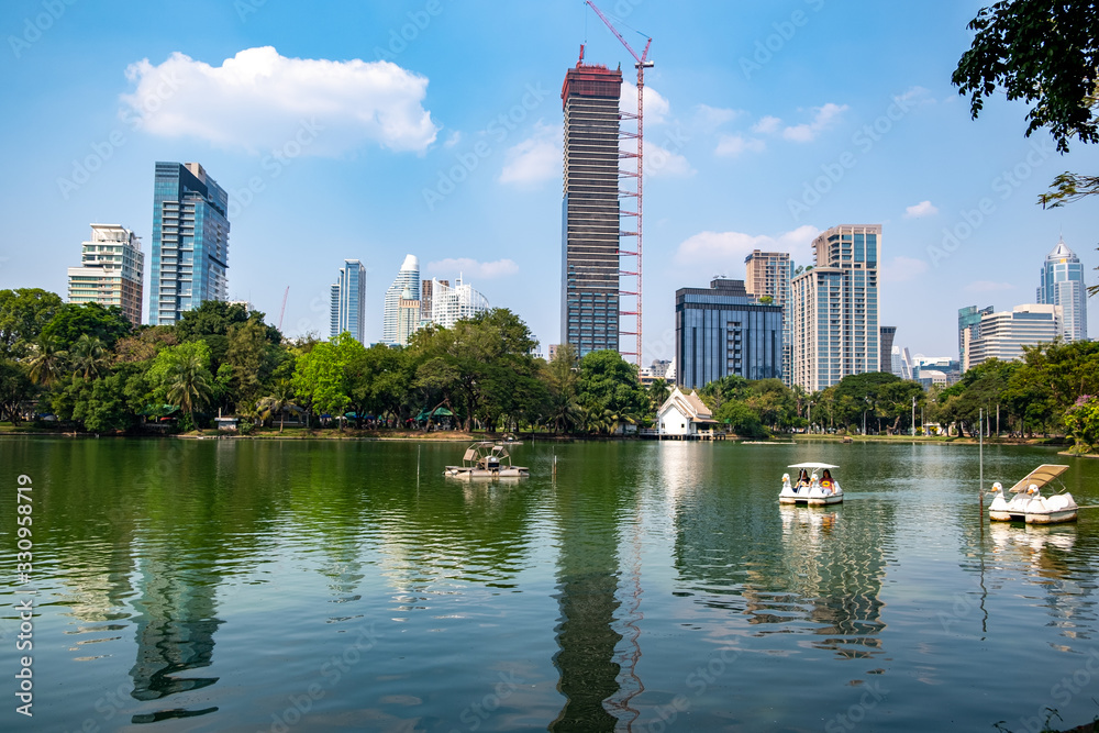 Fototapeta premium Beautiful view city scape Lumpini park in Bangkok City