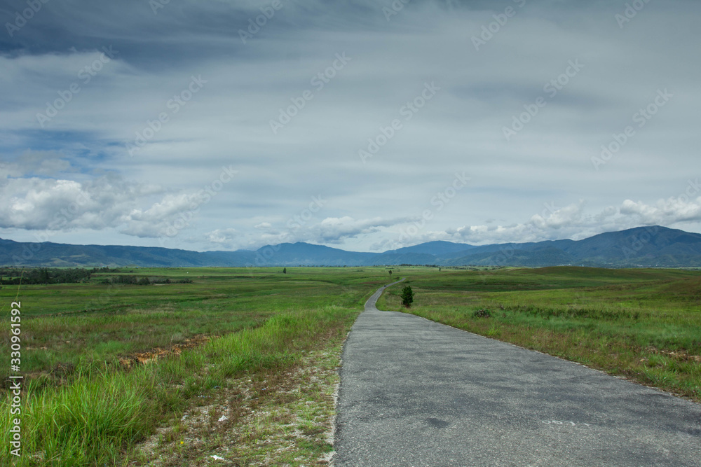 Road getting to mountains, Napu Village, Indonesia