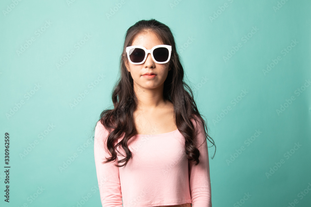 Portrait of a beautiful young asian girl in sunglasses. Portrait of a beautiful young asian girl in sunglasses.