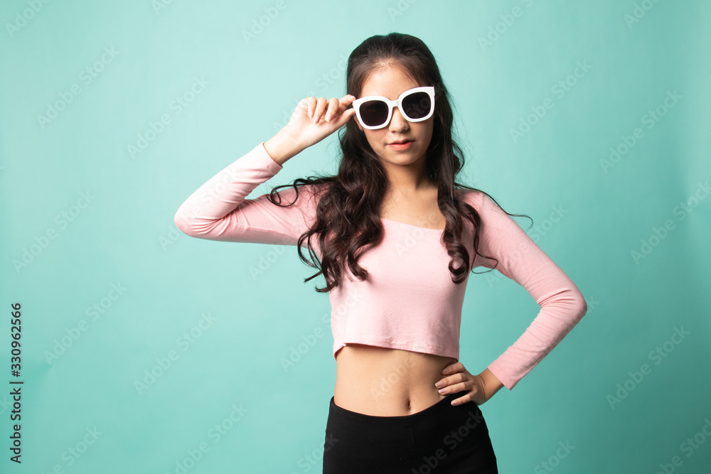 Portrait of a beautiful young asian girl in sunglasses. Portrait of a beautiful young asian girl in sunglasses.