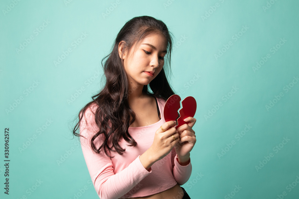 Beautiful young Asian woman with broken heart. Beautiful young Asian woman with broken heart.