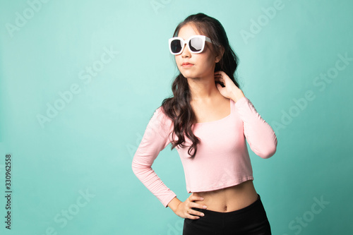 Portrait of a beautiful young asian girl in sunglasses. © halfbottle