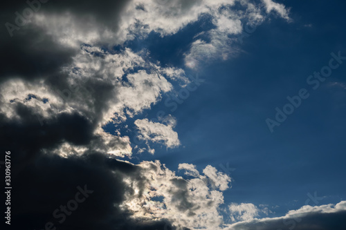 Blue sky with dark clouds. Nature background.