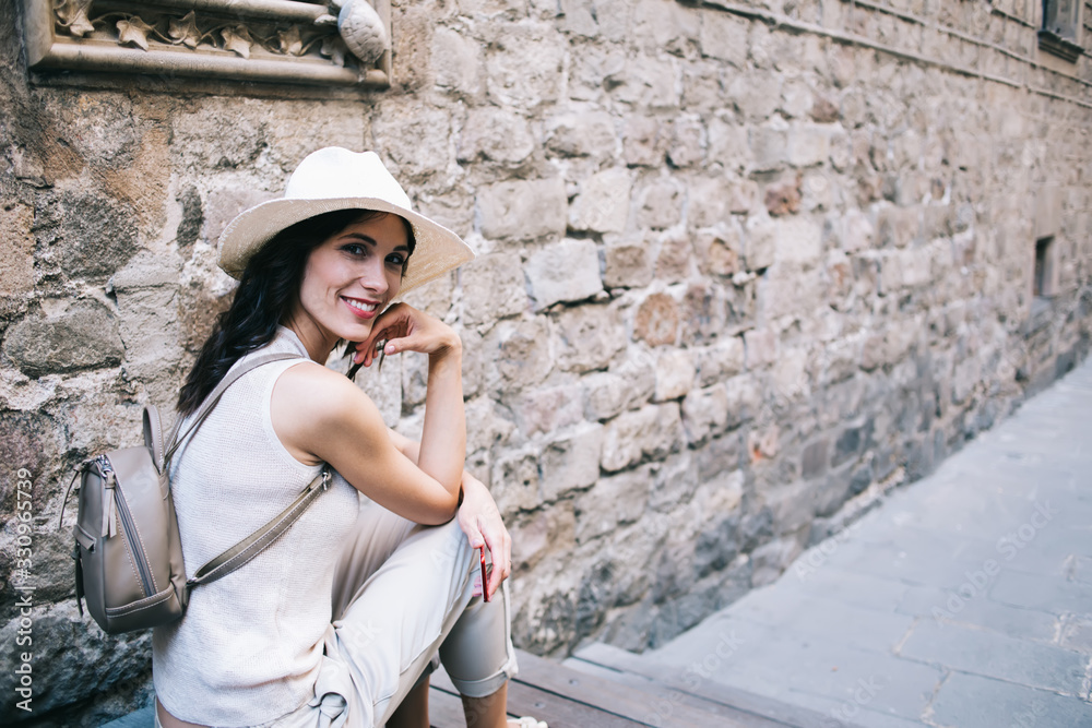 Happy relaxed tourist on street in old town Happy relaxed tourist on street in old town