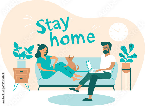 Family working from home. Man and woman sitting on couch and working on laptop