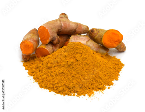 Turmeric (curcumin) rhizomes and powder isolated on a white background,Used for cooking and as herbal medicine.