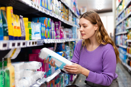 Portrait of woman customer buying personal hygiene items in the supermarket