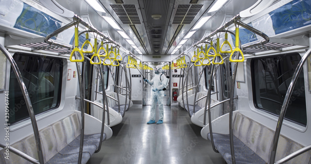 HazMat team in protective suits decontaminating metro car during virus outbreak - obrazy, fototapety, plakaty 