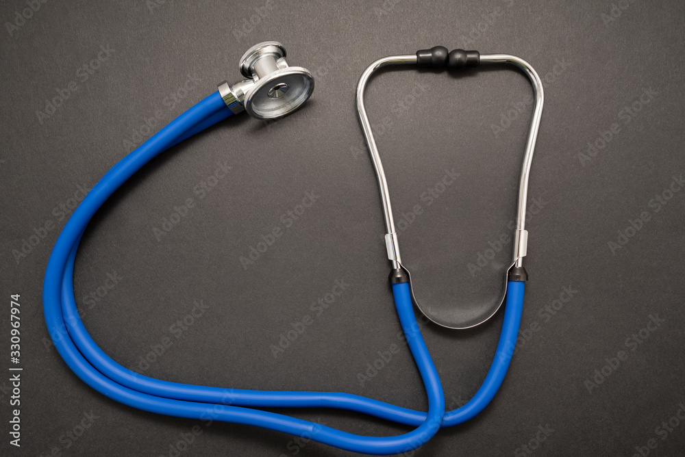 Stethoscope on black background, top view. Medical instrument Stethoscope on black background, top view. Medical instrument