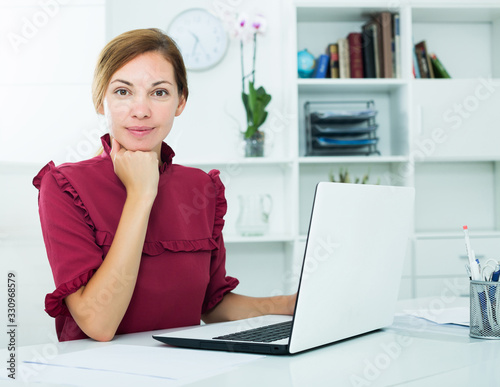 Woman working with laptop © JackF