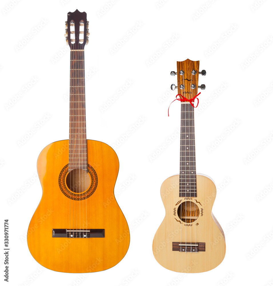 Obraz premium Acoustic and ukulele guitars isolated on white background