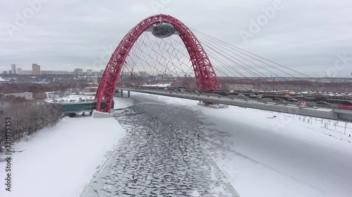 Moscow, Russia. Zhivopisniy bridge (beautiful red cable-stayed bridge) at winter. Aerial drone view photo