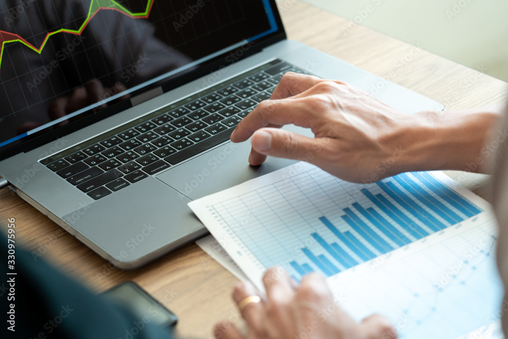 Working business man, team of broker or traders talking about forex on multiple computer screens of stock market invest trading financial graph charts data analysis. Working business man, team of broker or traders talking about forex on multiple computer screens of stock market invest trading financial graph charts data analysis.