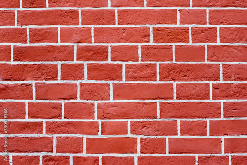 The brick wall is red with white joints. Textured background
