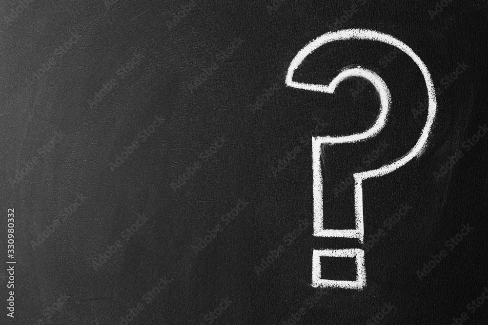 Fotografie Question mark drawn with chalk on blackboard, top view