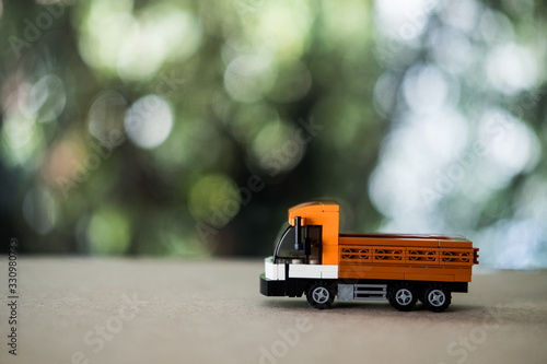 Model toy Thai trucks on wood table.