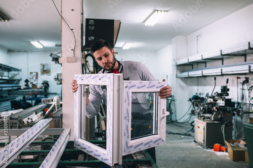 Aluminium and PVC industry worker making PVC or aluminium frames for windows and doors
