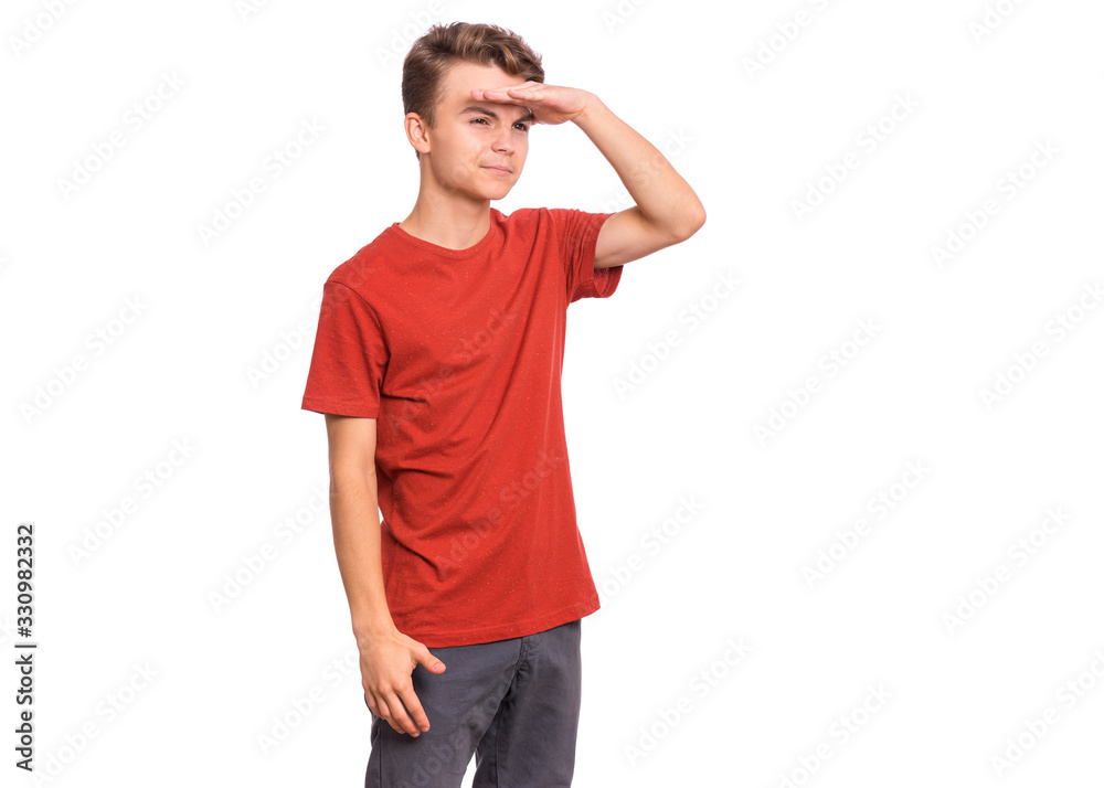 Portrait of serious teen boy looking far away with hand over head. Searching concept. Beautiful child holding hand at forehead looking far away distance, isolated on white background. Portrait of serious teen boy looking far away with hand over head. Searching concept. Beautiful child holding hand at forehead looking far away distance, isolated on white background.