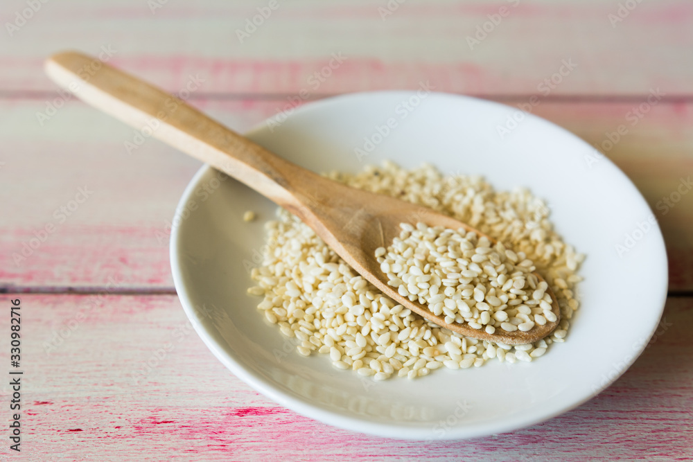 Closeup of sesame seeds in a wooden spoon. Closeup of sesame seeds in a wooden spoon.