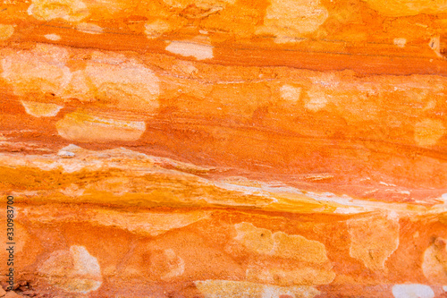 Beautiful colours and textures of a sandstone wall at Broome coastline