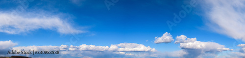 panorama of blue sky with white clouds on a clear Sunny day. photo for the banner. space for text