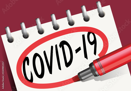 Le mot Coronavirus écrit au marqueur noir sur la page blanche d’un bloc-note et entouré de d’un cercle rouge.