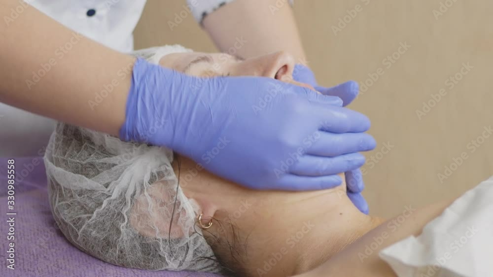 cosmetic face massage.beauty treatments in the spa salon cosmetic face massage.beauty treatments in the spa salon