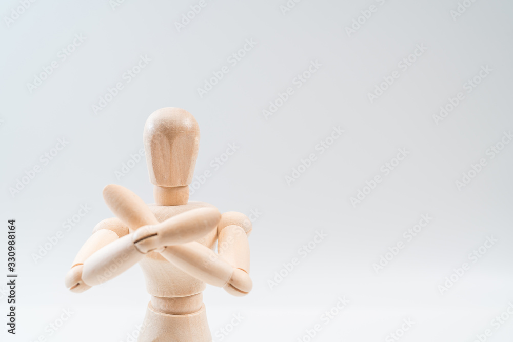 Refusal gesture, Wooden dummy, crossed hands on white background, copy space for your object or text Refusal gesture, Wooden dummy, crossed hands on white background, copy space for your object or text