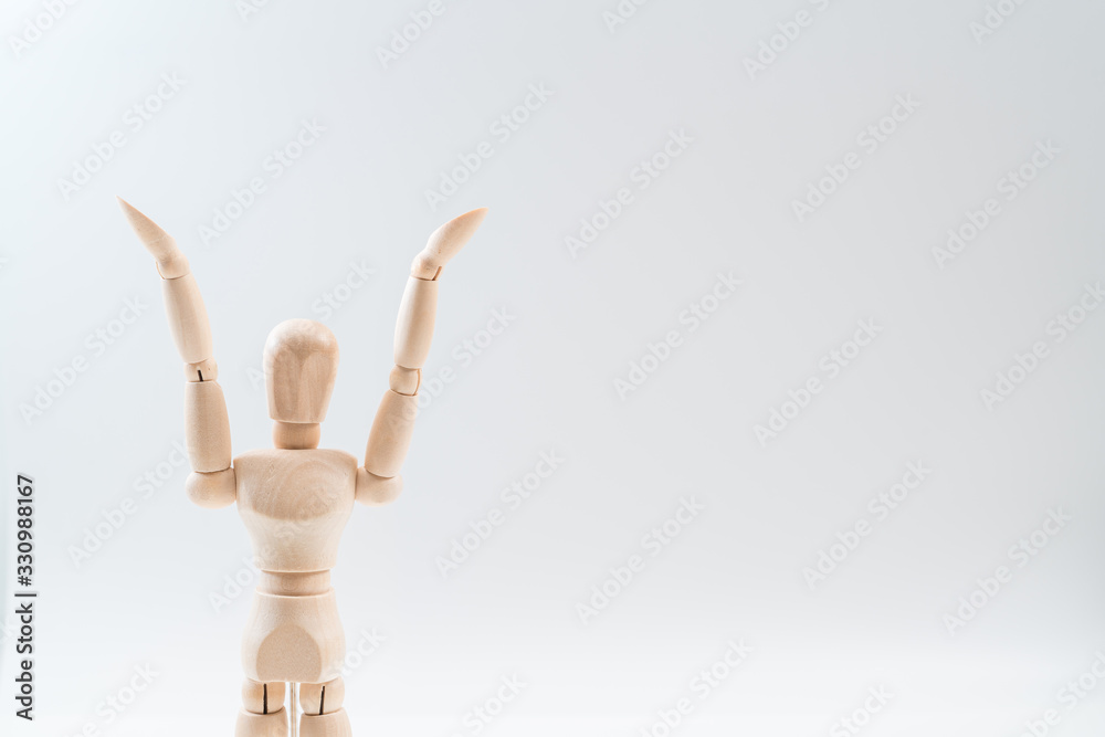 Raising Hands, Wooden dummy, Raising Hands on whiteBackground, copy space for your object or text Raising Hands, Wooden dummy, Raising Hands on whiteBackground, copy space for your object or text