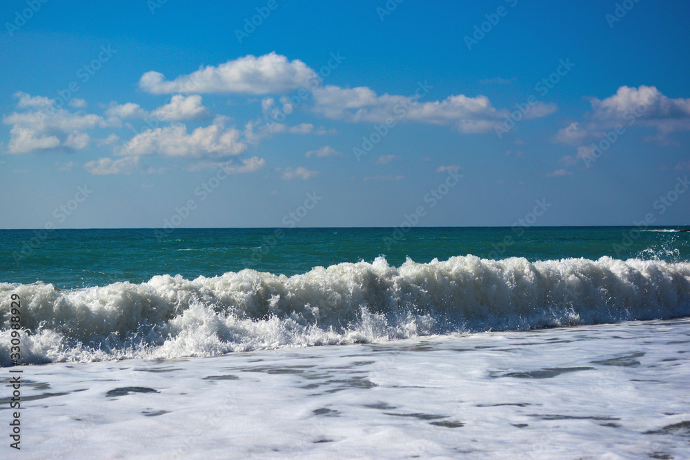 sea wave with foam and blue sky sea wave with foam and blue sky