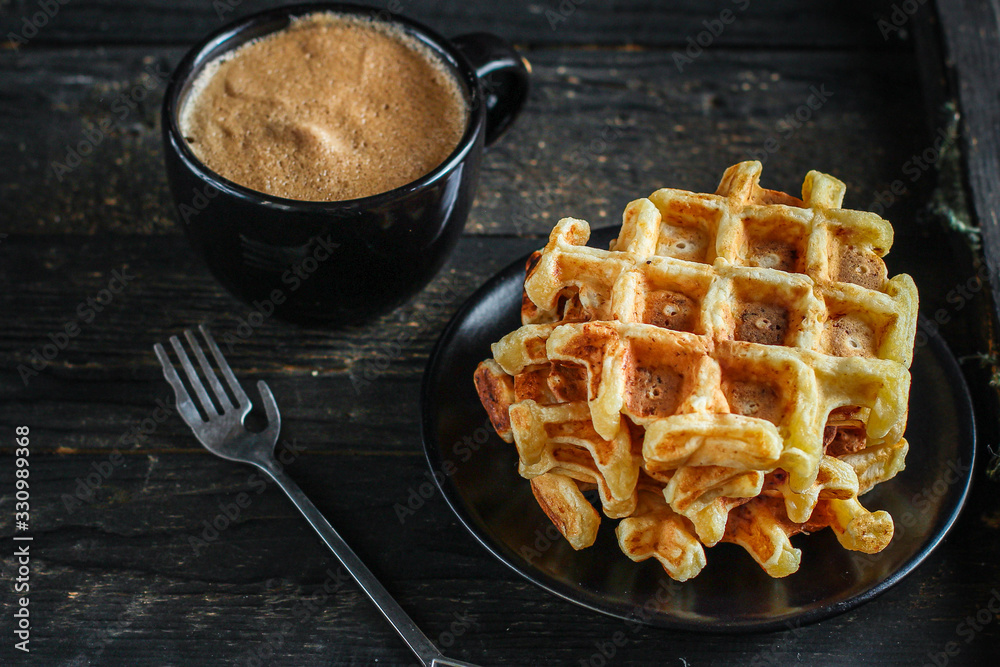 Belgian or american waffles (delicious sweet dish, dessert snack) menu concept. background. top view. copy space for text Belgian or american waffles (delicious sweet dish, dessert snack) menu concept. background. top view. copy space for text
