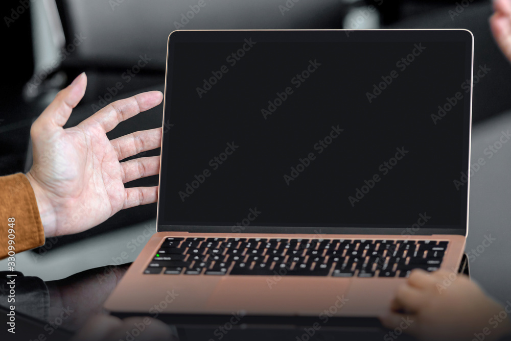Business people with a laptop discussing business Business people with a laptop discussing business