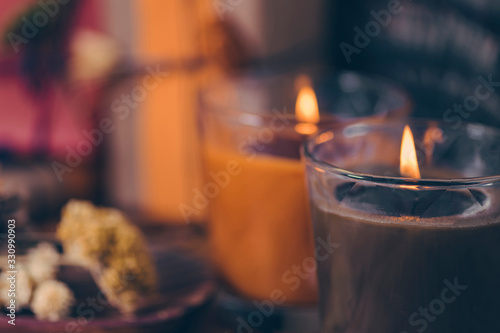 Foto Scented Candles, Presents, Dried Flowers and Leaf Decoration on a Table
