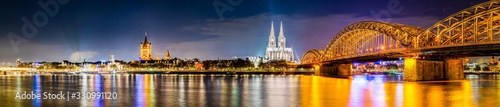 Panorama of Cologne at night with Cologne Cathedral, Rhine and Hohenzollern Bridge photo