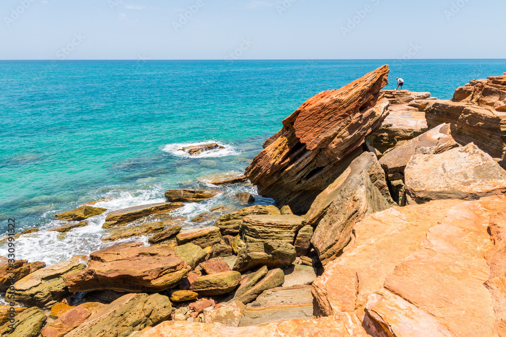 Broome, WA / Australia - People fishing off the hazardous cliff rocks