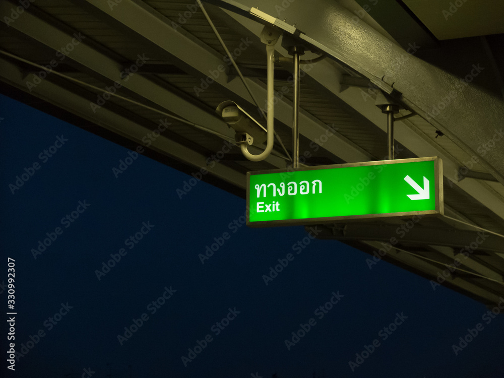 Green banner call exit way in Bangkok Sky Train System (BTS) Green banner call exit way in Bangkok Sky Train System (BTS)