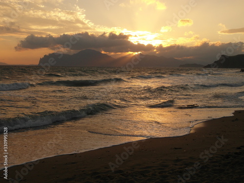 Sea waves at a colorful sunset