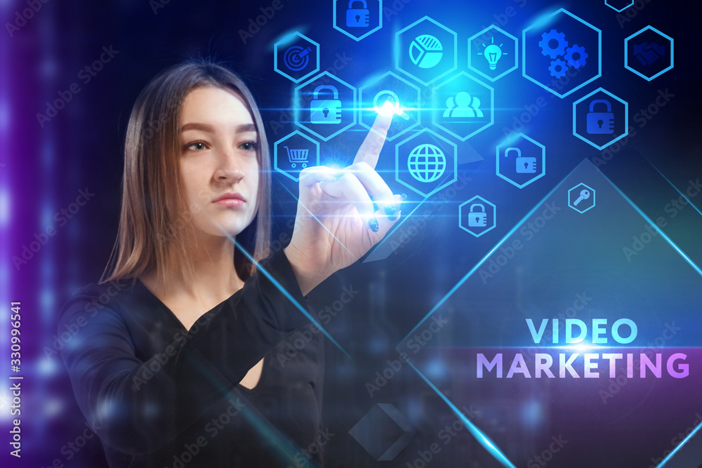 Business, Technology, Internet and network concept. Young businessman working on a virtual screen of the future and sees the inscription: Video marketing