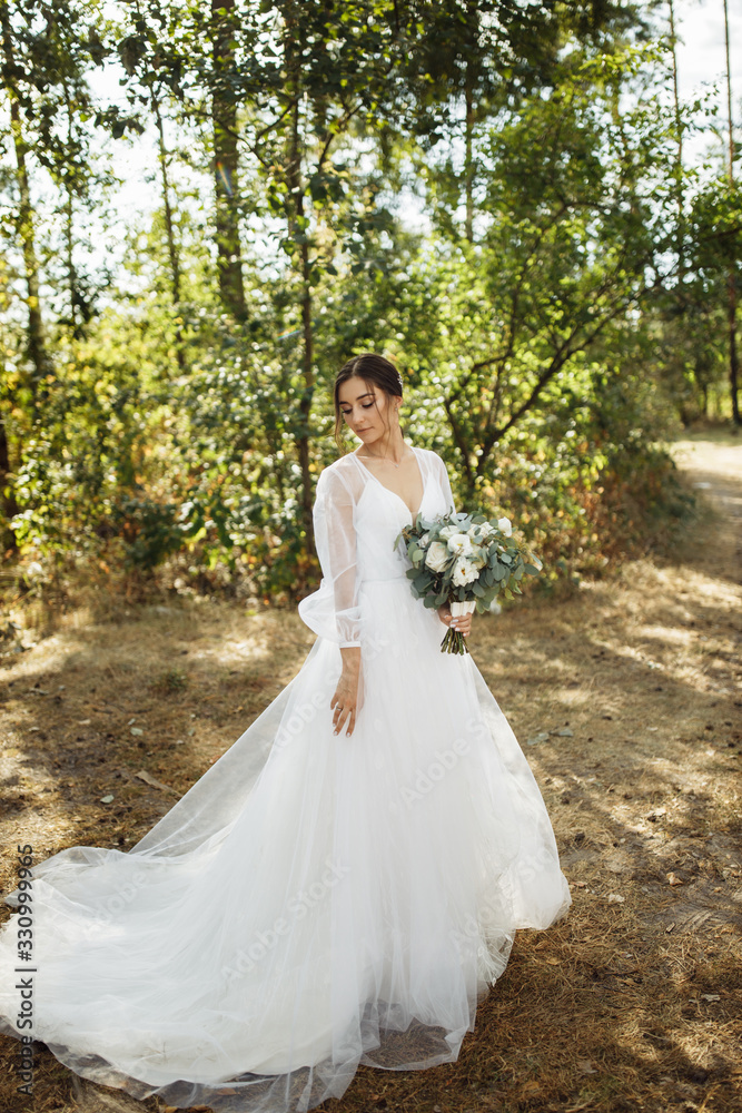 Beautiful bride on sunset in the forest Beautiful bride on sunset in the forest