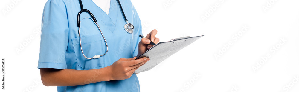 Cropped view of african american nurse with stethoscope writing on clipboard isolated on white, panoramic shot Cropped view of african american nurse with stethoscope writing on clipboard isolated on white, panoramic shot