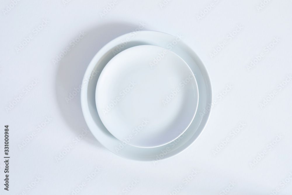 empty plate isolated on white background empty plate isolated on white background