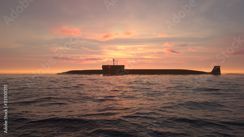 Heavy atomic submarine in ocean at sunset