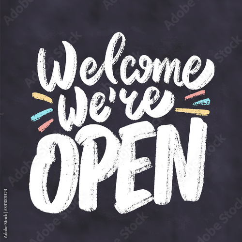 Welcome, we're open. Chalkboard sign.