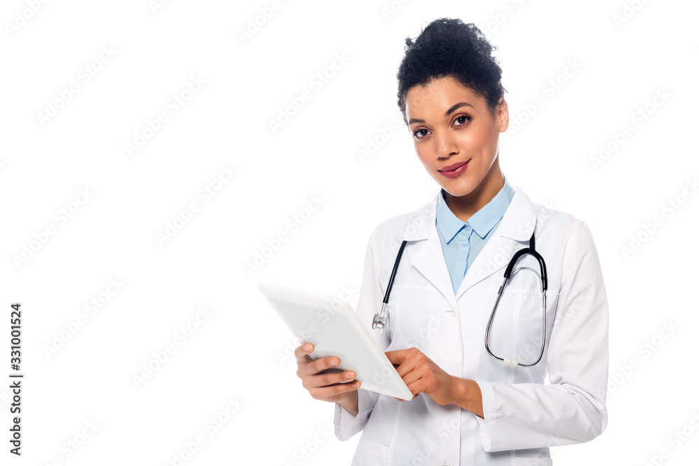 Front view of african american doctor with stethoscope and digital tablet looking at camera isolated on white Front view of african american doctor with stethoscope and digital tablet looking at camera isolated on white