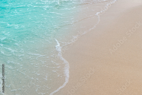 Soft wave of blue sea and sand on summer holidays beautiful beach, Background, Travel concept, Selective focus...