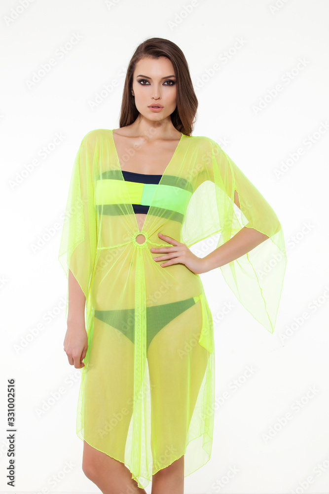 girl in stylish detailed black bikini and neon cover-up pareo. girl in stylish detailed black bikini and neon cover-up pareo.